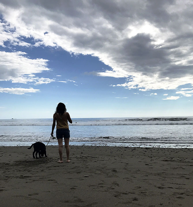 Girl and Dog at the Beach ~ Photo by Patrice